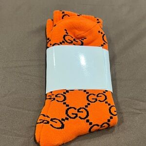GG Collection Orange Crew Socks with Black Logo Pattern